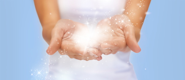 magic twinkles or fairy dust on female hands